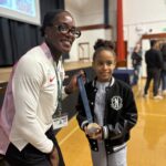 Camille-age-9-was-thrilled-to-meet-Victoria Ohuruogu at St Mary's and hold her Olympic medal